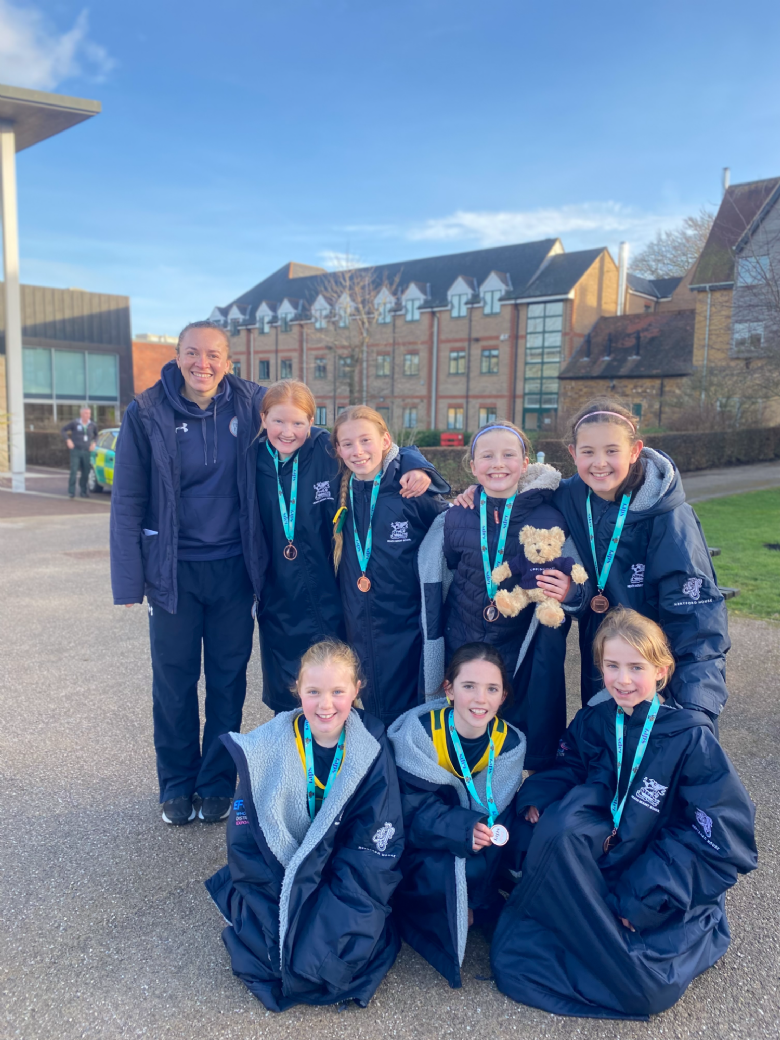 Children pose with England Netballer Hannah Joseph at IAPS Regional Finals