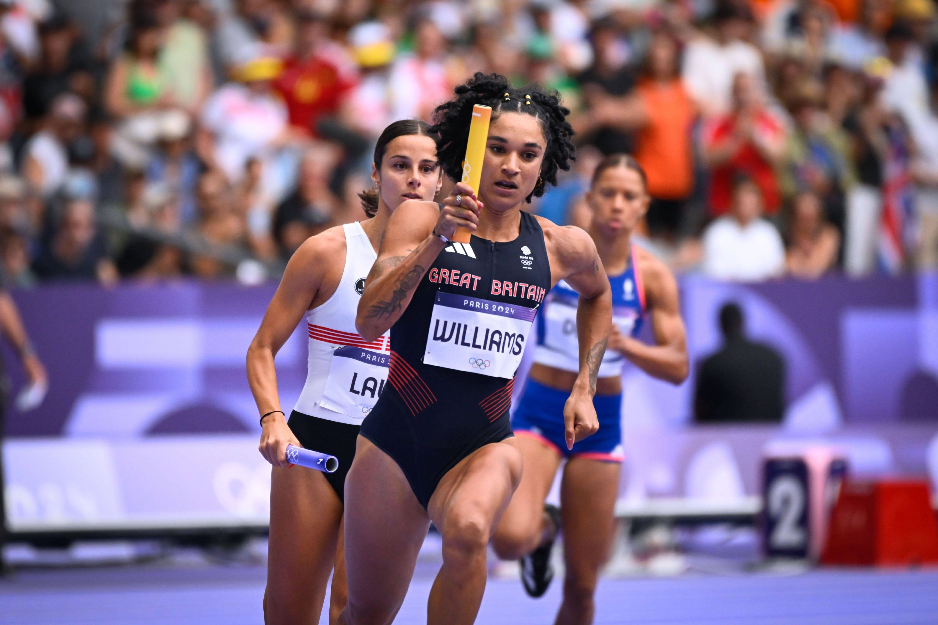 Jodie races in the women's 4x400m heats at the Paris Olympics Jodie Williams races with her baton in a heat of the women's 4x400m at the Paris Olympics