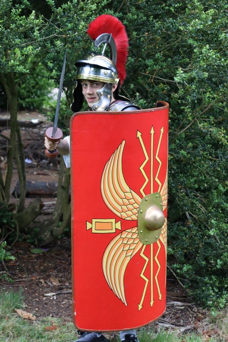 A pupil dresses up in Roman armour as part of a Latin curriculum day