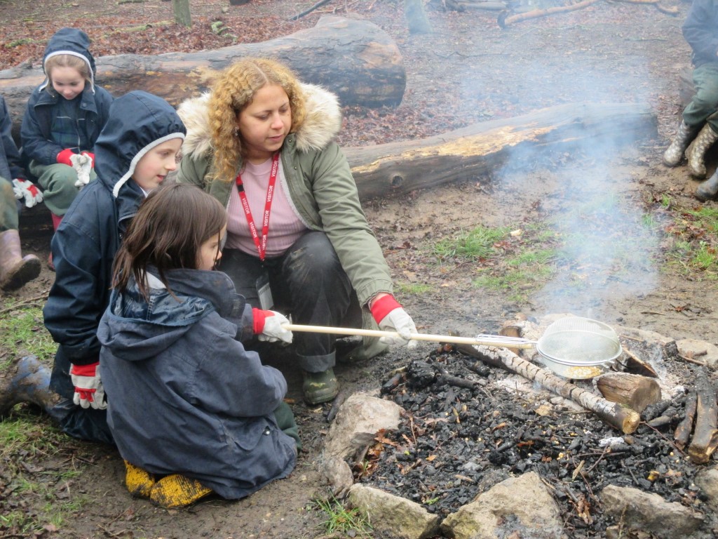 Parent volunteering at Forest School