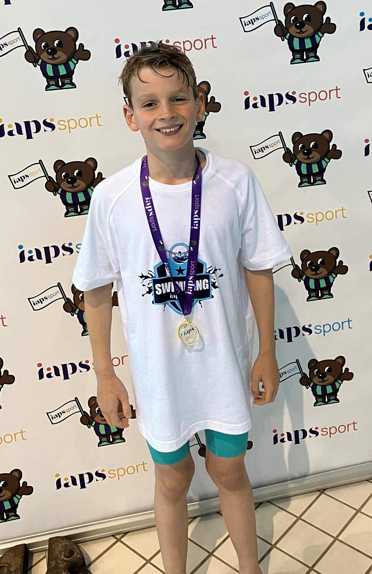 Charlie poses with his gold medal aft