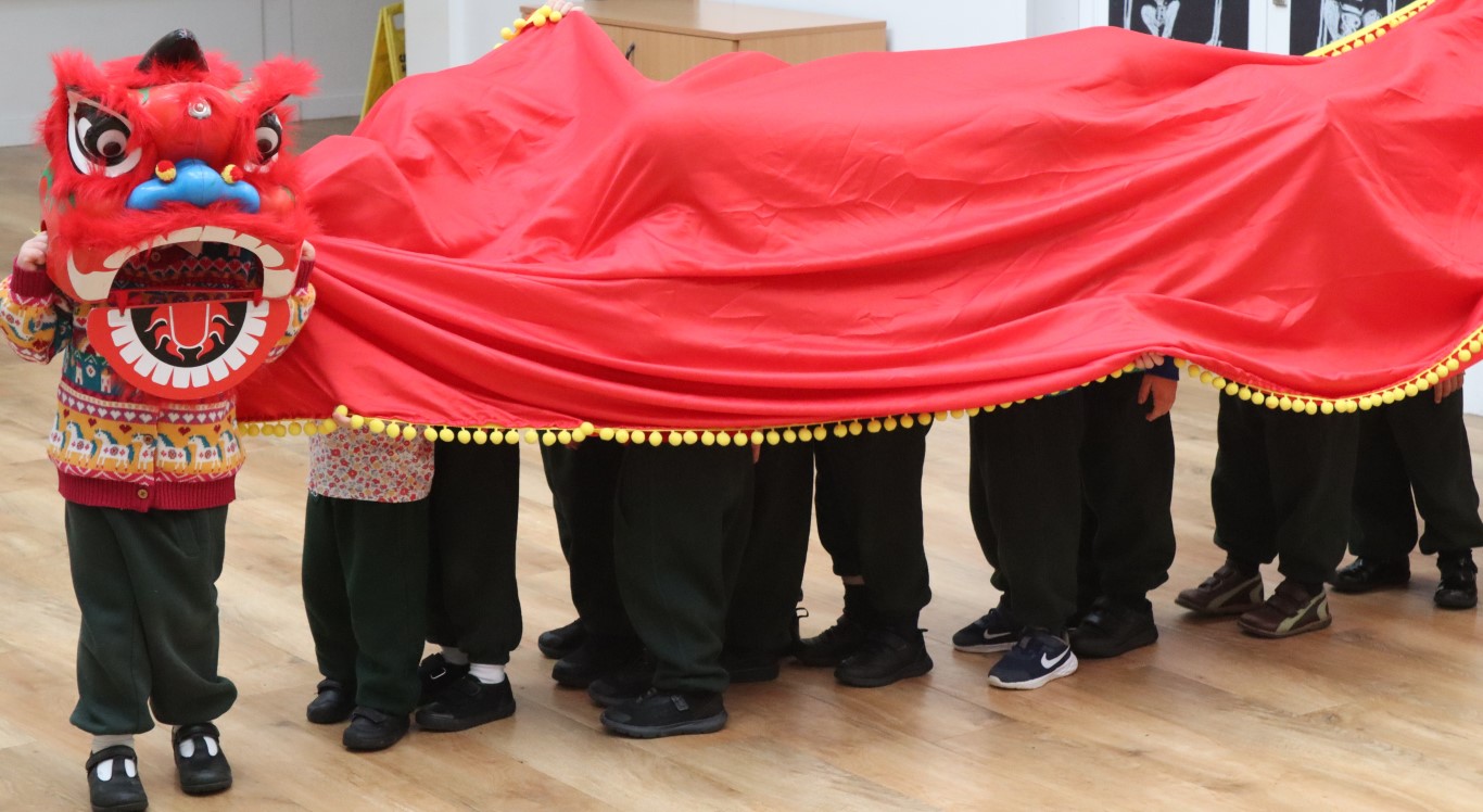 Nursery children take part in a dragon dance workshop