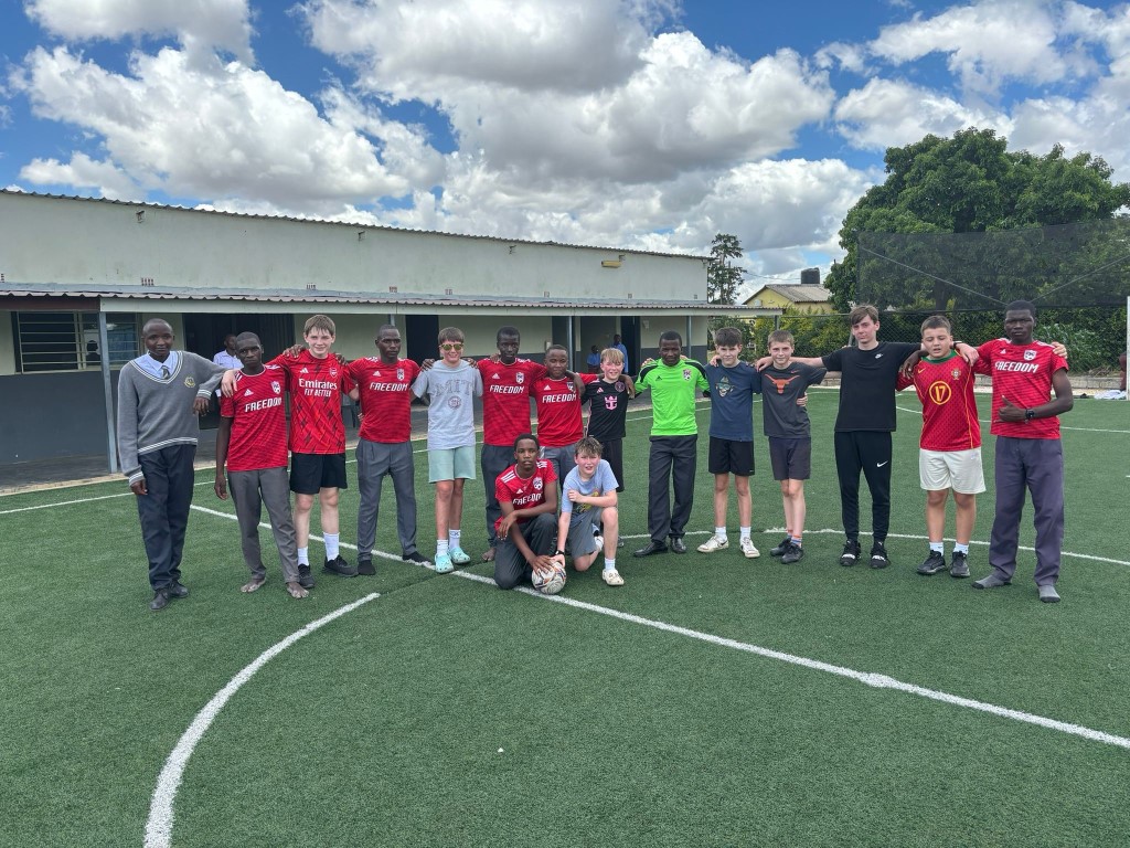 boys from Heath Mount School and Chesed Academy line up for a photo on the football pitch