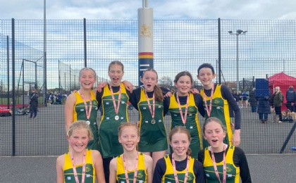 U13 Netball Team With Their Medals Win Place at IAPS National Netball Finals