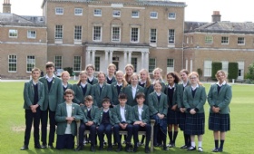 scholarship and award winners from Heath Mount's Class of 24 pose in the sunshine in front of the Grade I listed mansion house