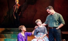 Tayt on stage with fellow cast members Dan Burton and Sophia Ragavelas